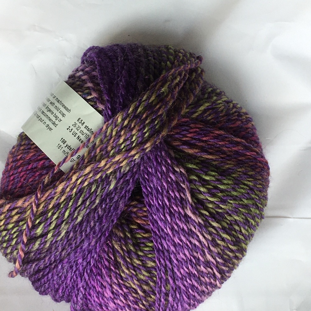 One unopened ball of multi-colored yarn, 198yds/50 grams, fingering weight